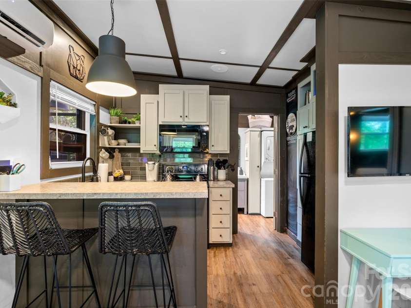 787 Ridge Road, Marion, NC 28752.  MLS# CAR4364254, YatesRealty ID 7790. MAC - Kitchen with island seating + desk area