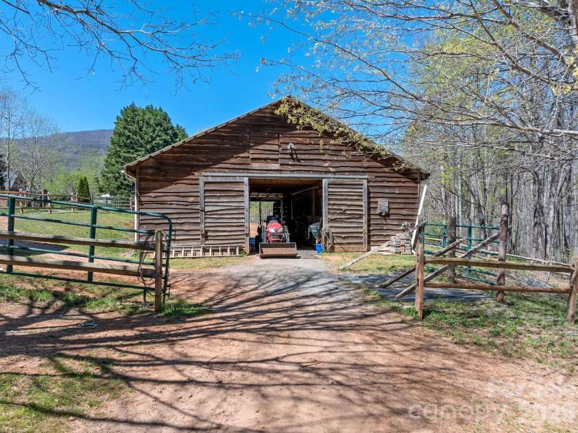 1434 Lake Adger Road, Mill Spring, NC 28756.  MLS# CAR4363547, YatesRealty ID 7791. 6 stall barn