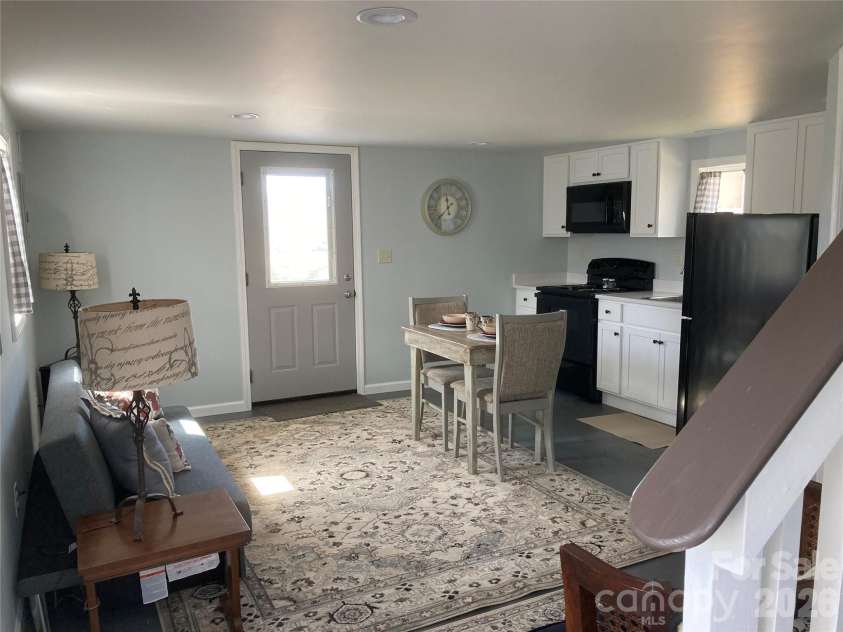 1434 Lake Adger Road, Mill Spring, NC 28756.  MLS# CAR4363547, YatesRealty ID 7791. ADU kitchen/living room
