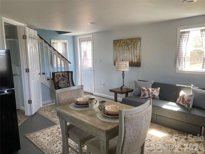 1434 Lake Adger Road, Mill Spring, NC 28756.  MLS# CAR4363547, YatesRealty ID 7791. ADU living room area