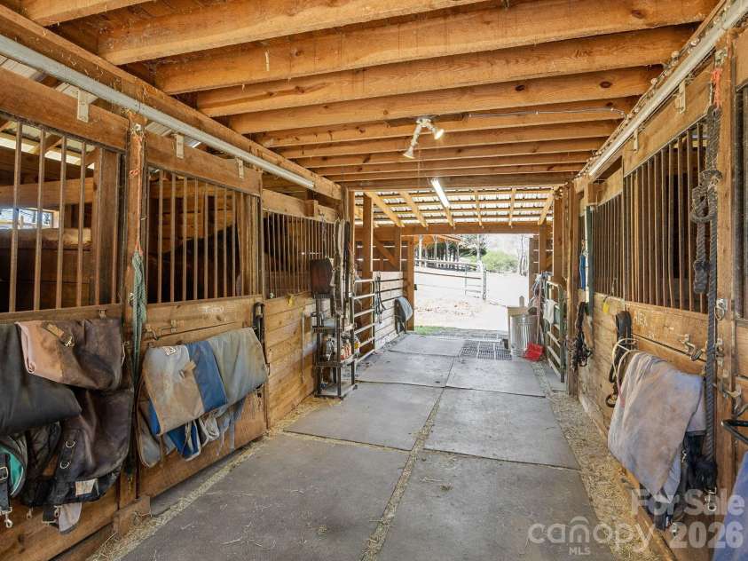 1434 Lake Adger Road, Mill Spring, NC 28756.  MLS# CAR4363547, YatesRealty ID 7791. Center aisle barn