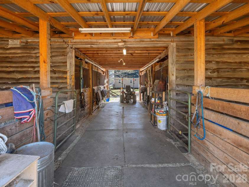 1434 Lake Adger Road, Mill Spring, NC 28756.  MLS# CAR4363547, YatesRealty ID 7791. Center aisle barn