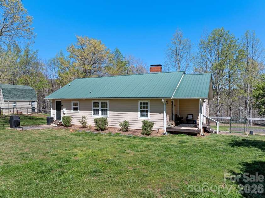 1434 Lake Adger Road, Mill Spring, NC 28756.  MLS# CAR4363547, YatesRealty ID 7791. Side view from road