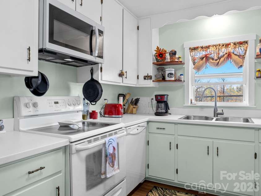 1434 Lake Adger Road, Mill Spring, NC 28756.  MLS# CAR4363547, YatesRealty ID 7791. Sunny Kitchen