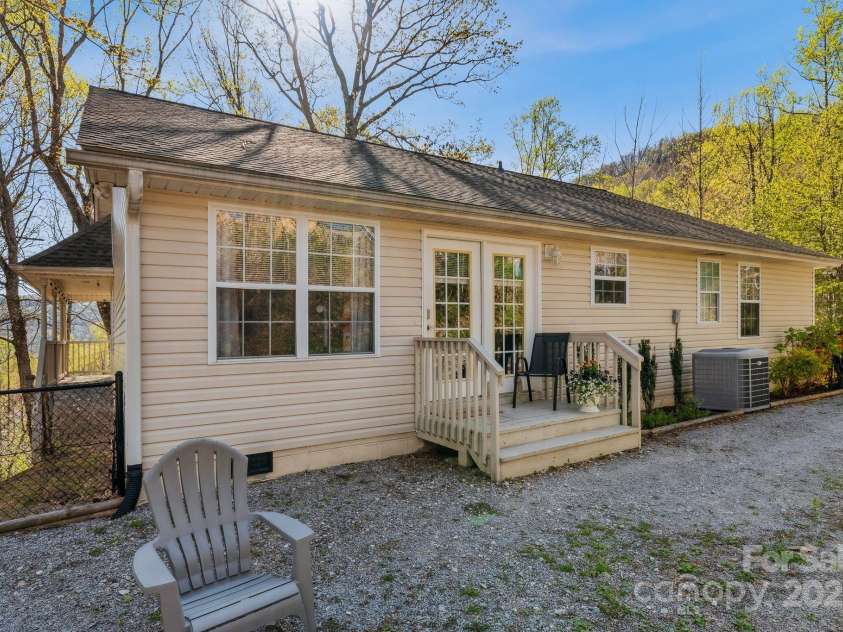 12 Hutchinson Woods Drive, Fletcher, NC 28732.  MLS# CAR4238385, YatesRealty ID 7792. Convenient area to park or entertain at the firepit.