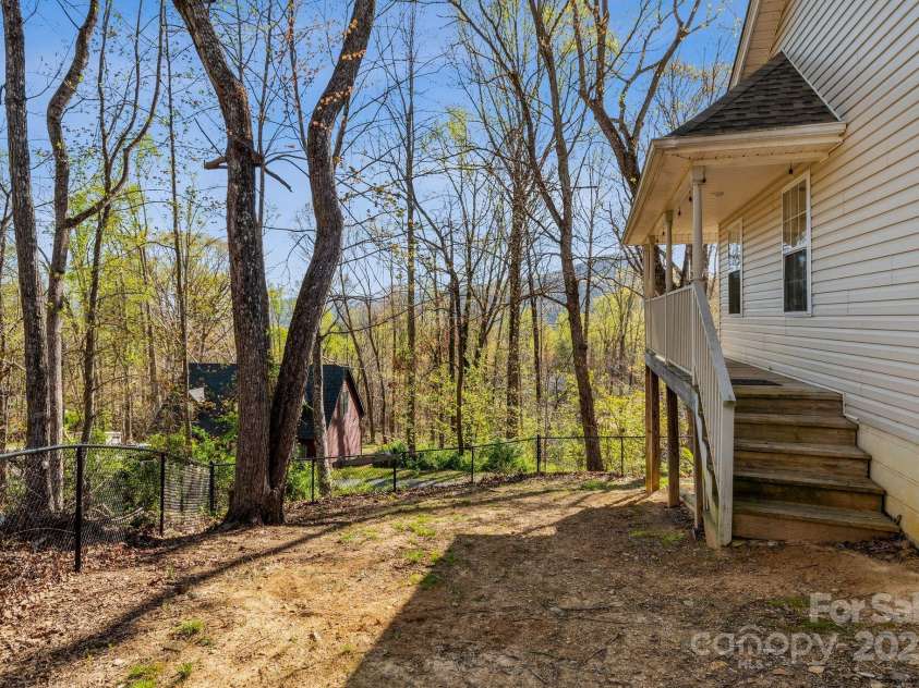 12 Hutchinson Woods Drive, Fletcher, NC 28732.  MLS# CAR4238385, YatesRealty ID 7792. Fenced in yard.  This works great for pets.