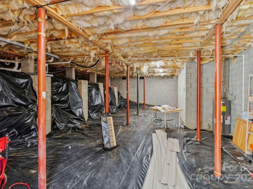 12 Hutchinson Woods Drive, Fletcher, NC 28732.  MLS# CAR4238385, YatesRealty ID 7792. Newly encapsulated oversized crawlspace.  Great for storage.