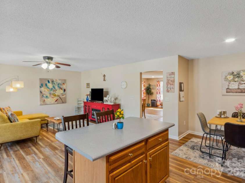 12 Hutchinson Woods Drive, Fletcher, NC 28732.  MLS# CAR4238385, YatesRealty ID 7792. Open floor plan makes this a flexible area.  Create a formal dining room or an extra den.