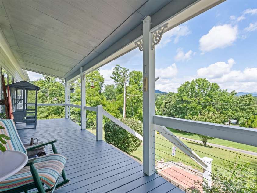 32 Perseverance Drive, Canton, NC 28716.  MLS# CAR4358563, YatesRealty ID 7799. Rocking chair front porch