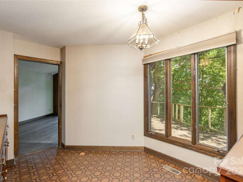 120 Pinewood Circle, Laurel Park, NC 28739.  MLS# CAR4187518, YatesRealty ID 7811. Breakfast Area leading to Living Room