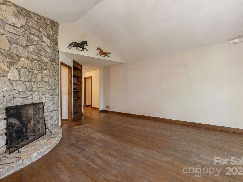 120 Pinewood Circle, Laurel Park, NC 28739.  MLS# CAR4187518, YatesRealty ID 7811. Floor to Ceiling Stone Fireplace