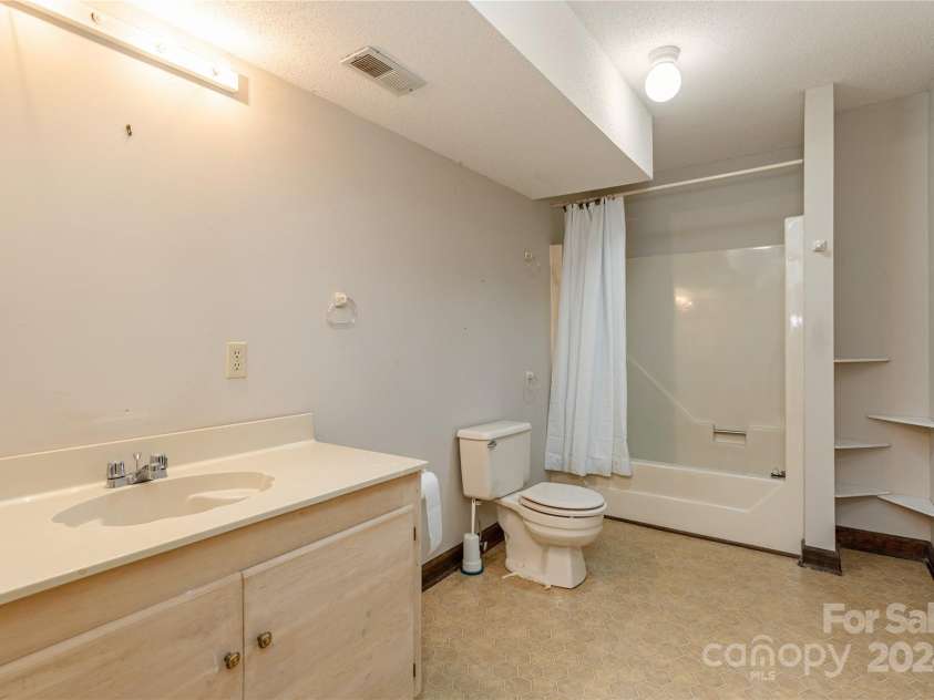 120 Pinewood Circle, Laurel Park, NC 28739.  MLS# CAR4187518, YatesRealty ID 7811. Lower Level Bathroom