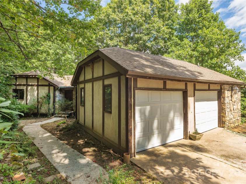 120 Pinewood Circle, Laurel Park, NC 28739.  MLS# CAR4187518, YatesRealty ID 7811. Modern Hip and valley roof design