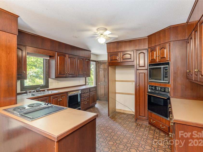 120 Pinewood Circle, Laurel Park, NC 28739.  MLS# CAR4187518, YatesRealty ID 7811. Original Cherry Cabinets