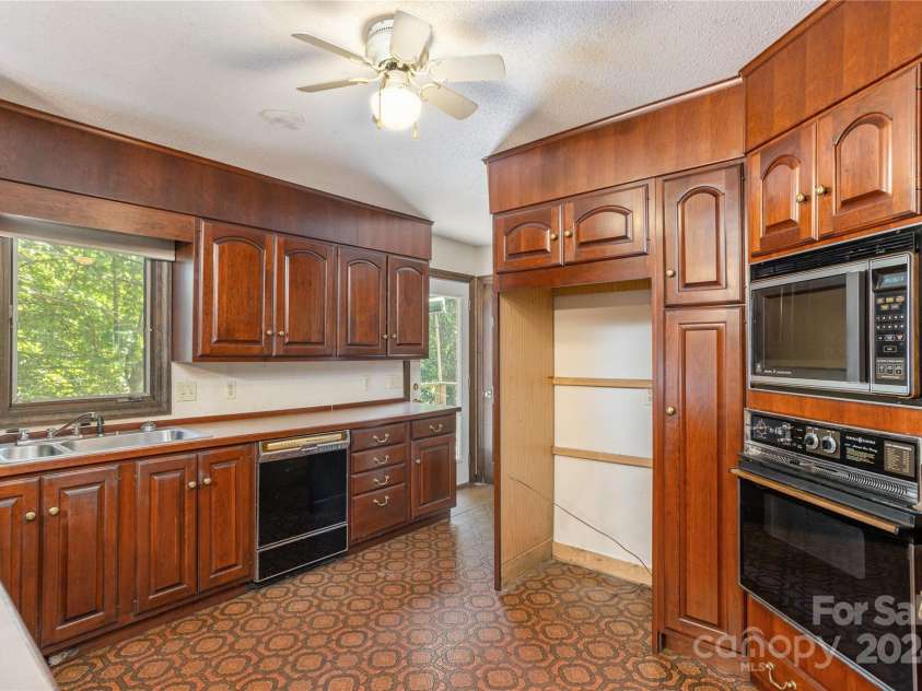 120 Pinewood Circle, Laurel Park, NC 28739.  MLS# CAR4187518, YatesRealty ID 7811. Original Cherry Cabinets