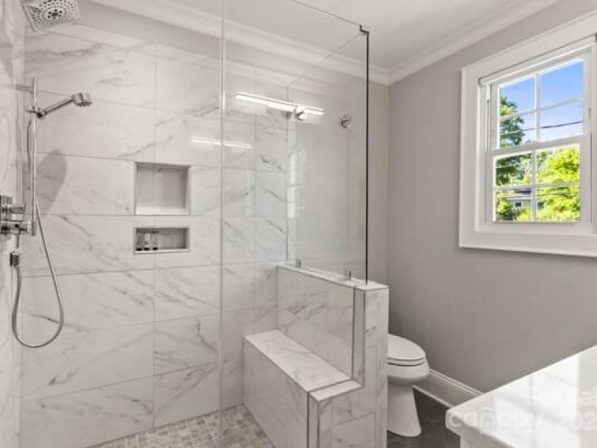 241 Wakefield Drive, Charlotte, NC 28209.  MLS# CAR4248262, YatesRealty ID 7816. Enlarged bath with spa like materials and design to maximize space and comfort