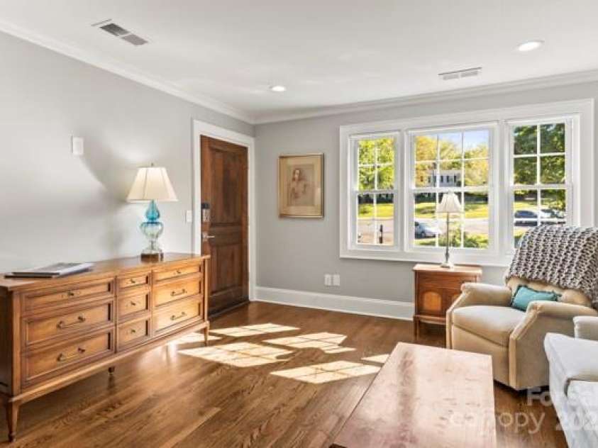 241 Wakefield Drive, Charlotte, NC 28209.  MLS# CAR4248262, YatesRealty ID 7816. Large living room area with all new walls and crown molding