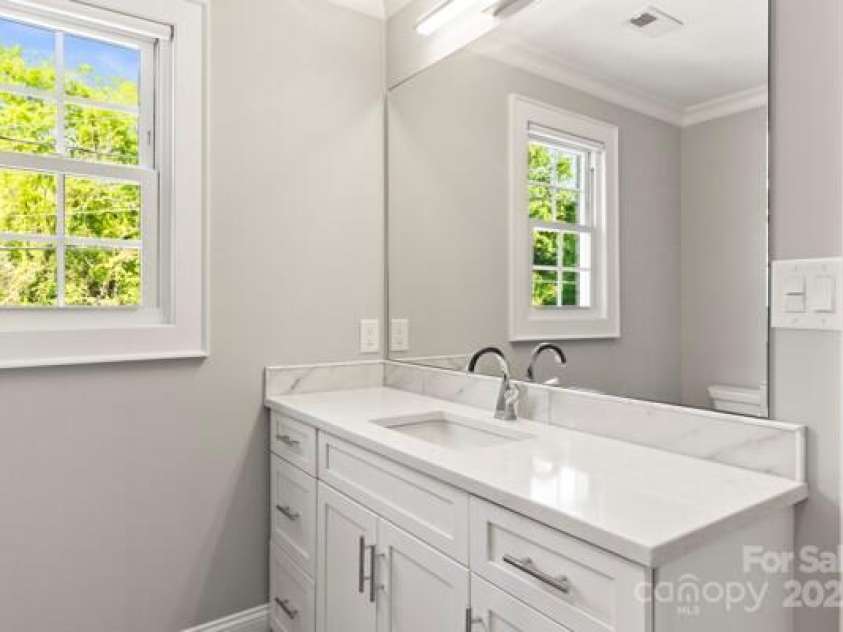 241 Wakefield Drive, Charlotte, NC 28209.  MLS# CAR4248262, YatesRealty ID 7816. The enlargement allowed for a larger Sink and Vanity