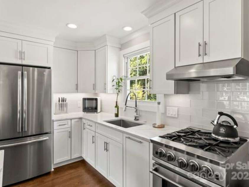 241 Wakefield Drive, Charlotte, NC 28209.  MLS# CAR4248262, YatesRealty ID 7816. The Kitchen has all new cabinets with unbelievable amount of storage. Restaurant quality gas stove,and under cabinet lights
