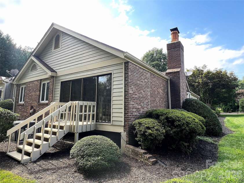 108 Glenbrook Drive, Hendersonville, NC 28739.  MLS# CAR4363228, YatesRealty ID 7817. Back Deck Leads to Sunroom