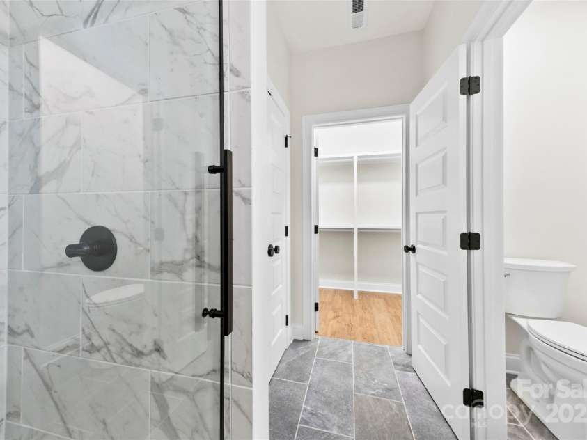 412 Westview Street, Gastonia, NC 28052.  MLS# CAR4222736, YatesRealty ID 7822. Custom Walk in Tiled Shower & Closet in Primary Bath