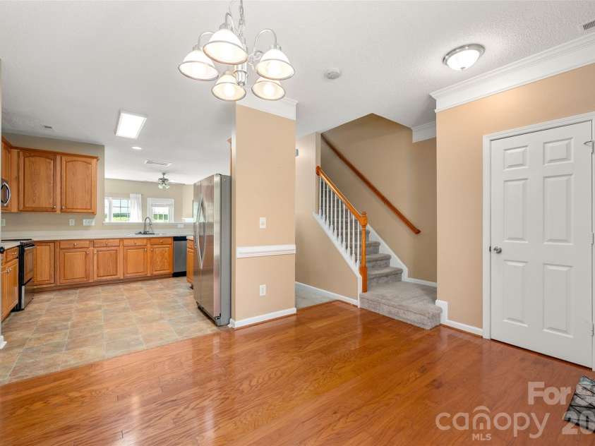 6934 Tanners Creek Drive, Huntersville, NC 28078.  MLS# CAR4303299, YatesRealty ID 7827. Entry Hall with Dining area open to the Kitchen, convenient half bathroom located on the right