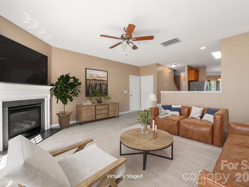 6934 Tanners Creek Drive, Huntersville, NC 28078.  MLS# CAR4303299, YatesRealty ID 7827. Living room with coat closet and access to the 2 car garage adjacent to main living area