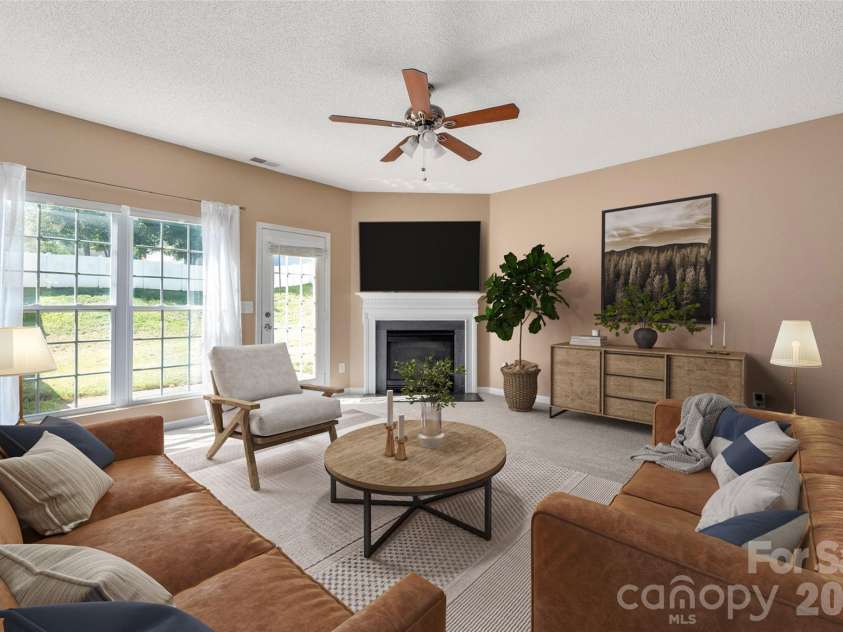 6934 Tanners Creek Drive, Huntersville, NC 28078.  MLS# CAR4303299, YatesRealty ID 7827. Living Room with views of the open back yard