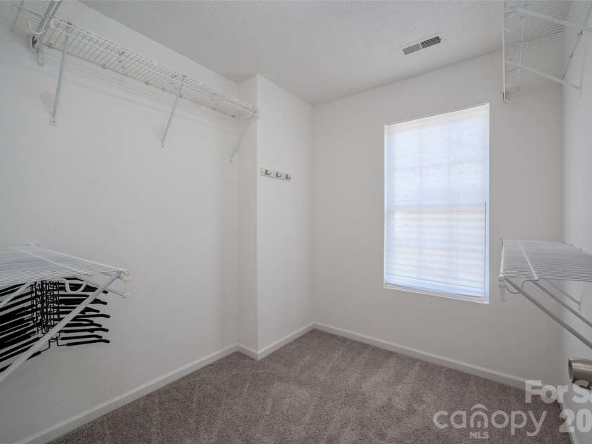 6934 Tanners Creek Drive, Huntersville, NC 28078.  MLS# CAR4303299, YatesRealty ID 7827. Primary suite walk-in closet