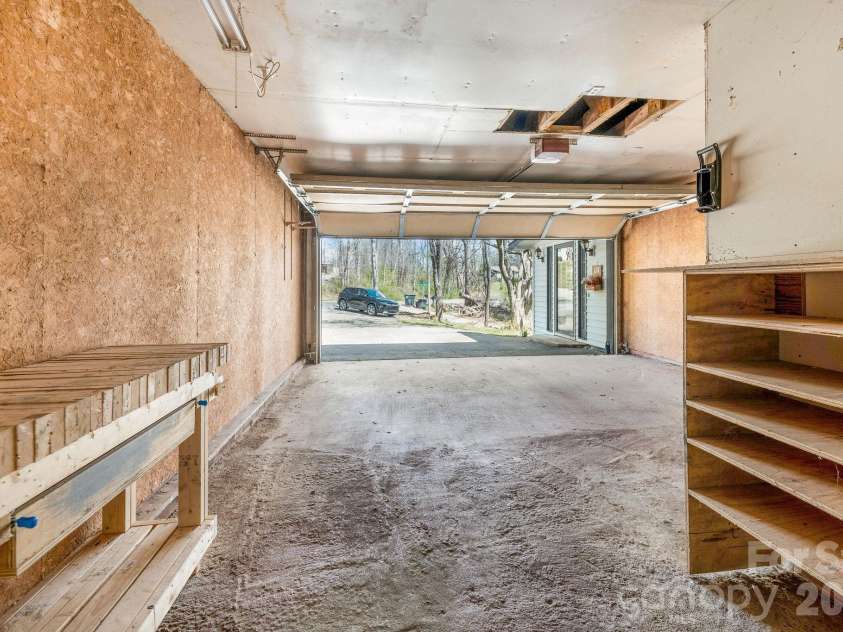 18 Peaceful Valley Lane, Flat Rock, NC 28731.  MLS# CAR4346213, YatesRealty ID 7830. 2 car garage.
