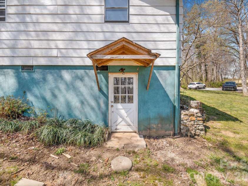 18 Peaceful Valley Lane, Flat Rock, NC 28731.  MLS# CAR4346213, YatesRealty ID 7830. Basement access. 