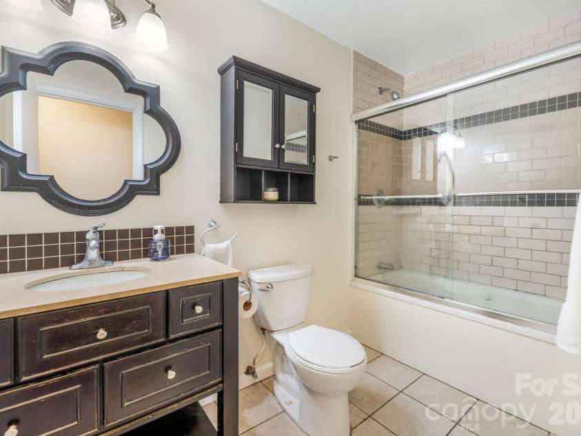 18 Peaceful Valley Lane, Flat Rock, NC 28731.  MLS# CAR4346213, YatesRealty ID 7830. Full bathroom in hall. 