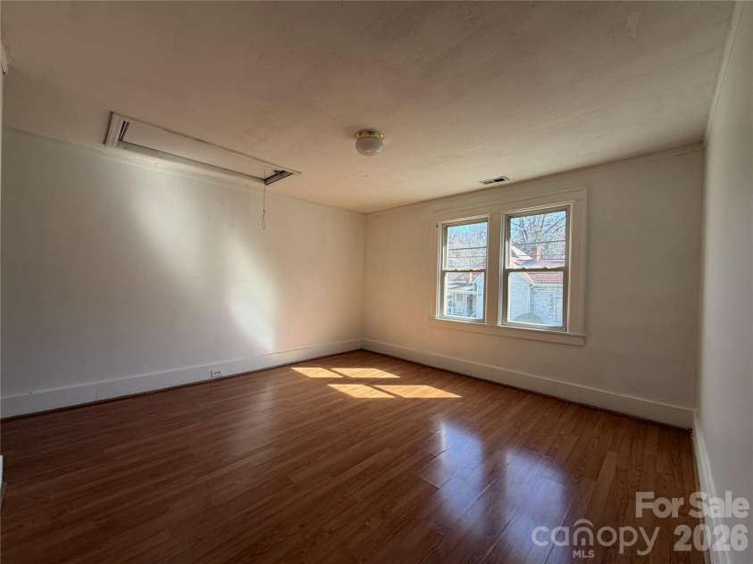 208 3rd Street, Albemarle, NC 28001.  MLS# CAR4358248, YatesRealty ID 7833. Bright bedroom with large windows — generous size and sunlight that helps you command higher rents with zero extra work.