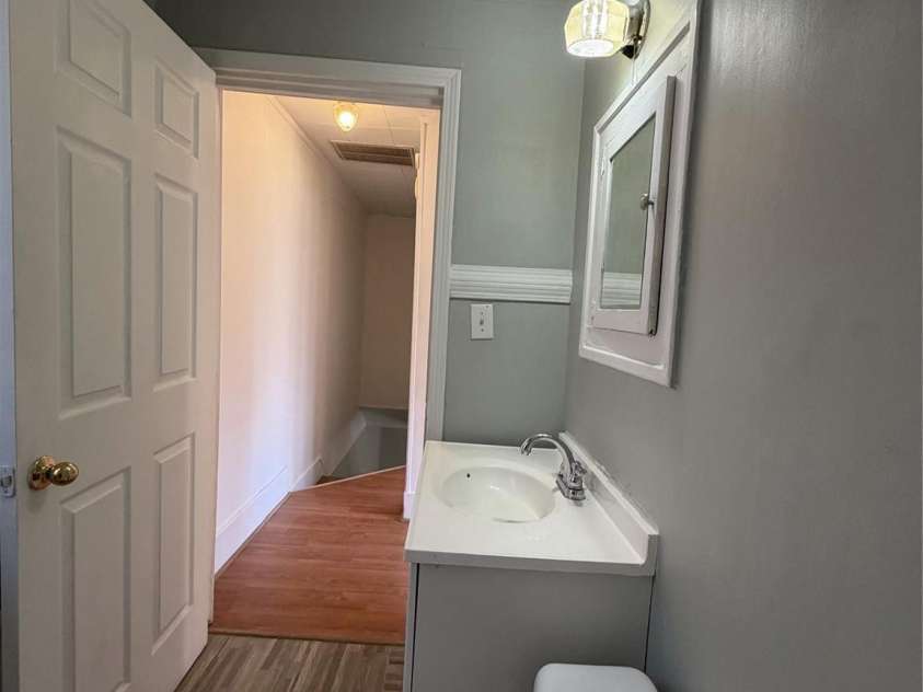 208 3rd Street, Albemarle, NC 28001.  MLS# CAR4358248, YatesRealty ID 7833. Bright upper level bathroom — private, clean, and move-in ready so you can turn units fast, keep occupancy high, and spend almost nothing on turnover work.
