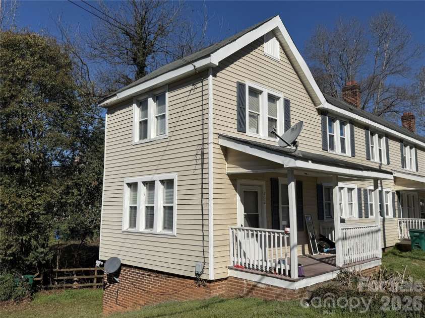 208 3rd Street, Albemarle, NC 28001.  MLS# CAR4358248, YatesRealty ID 7833. Clean, multi-unit profile with individual covered porches—a private, townhome-style layout that commands premium rents and eliminates shared-space liability.