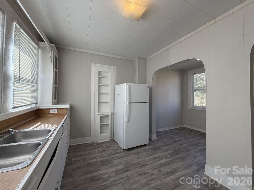 208 3rd Street, Albemarle, NC 28001.  MLS# CAR4358248, YatesRealty ID 7833. Efficiency-first kitchen. Large windows provide passive solar heat in winter, keeping the unit 