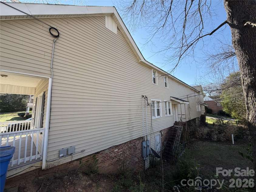 208 3rd Street, Albemarle, NC 28001.  MLS# CAR4358248, YatesRealty ID 7833. Rear egress. Solid brick foundation and safety infrastructure for multi-unit compliance and utility access so service calls are quick and cheap..