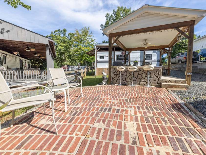171 Holly Harbor Trail, Mount Gilead, NC 27306.  MLS# CAR4309223, YatesRealty ID 7834. Brick Patio for extra seating