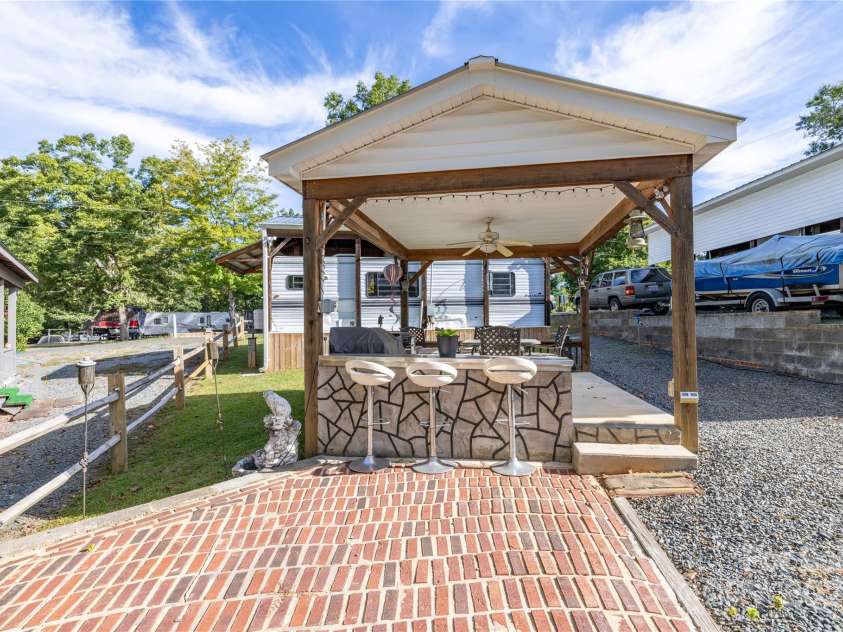 171 Holly Harbor Trail, Mount Gilead, NC 27306.  MLS# CAR4309223, YatesRealty ID 7834. Built-In Bar with Stools