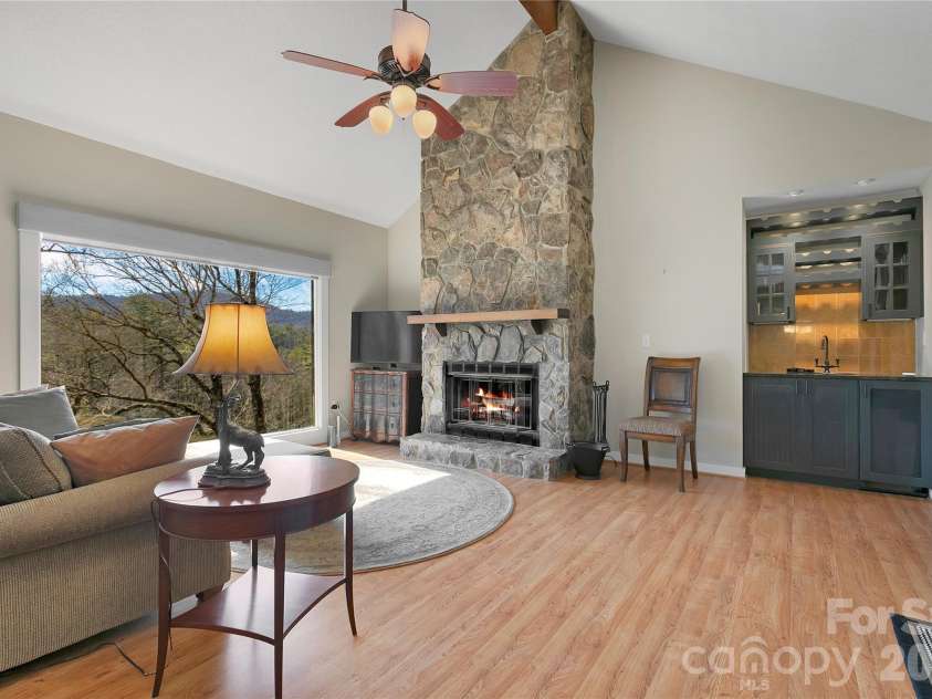 150 Racquet Club Villas Drive, Sapphire, NC 28774.  MLS# CAR4346144, YatesRealty ID 7838. Stunning fireplace