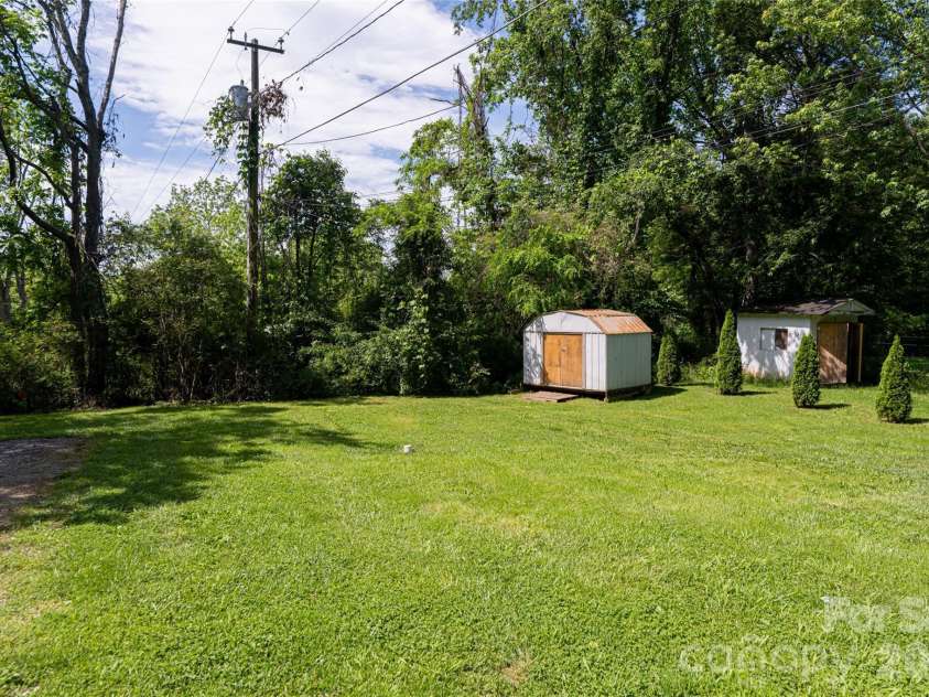 345 Lower Grassy Branch Road, Asheville, NC 28805.  MLS# CAR4364075, YatesRealty ID 7867. Level backyard