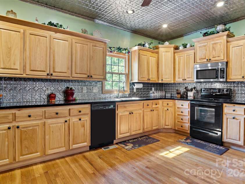 967 Clear Water Drive, Nebo, NC 28761.  MLS# CAR4147969, YatesRealty ID 7868. A big and well laid out kitchen  is spacious enough to dance in!