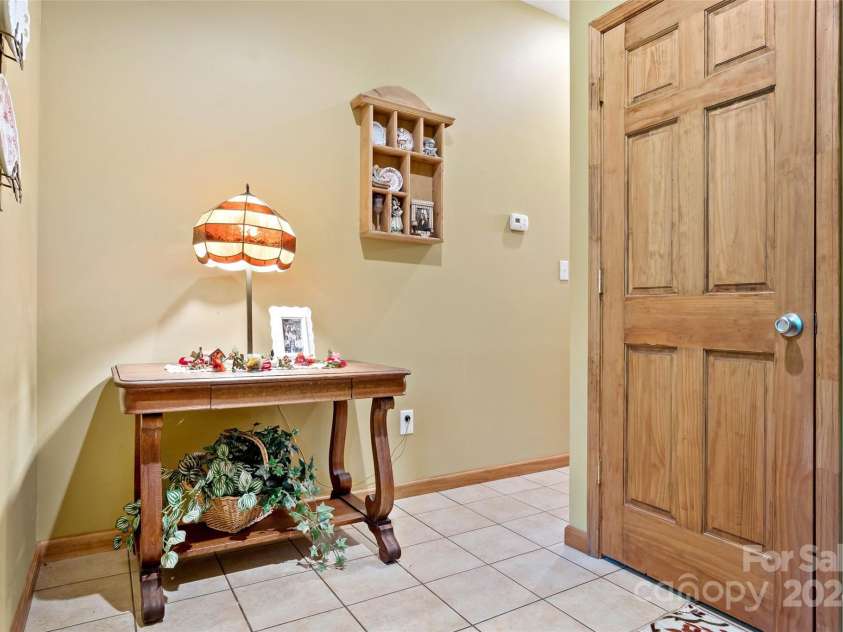 967 Clear Water Drive, Nebo, NC 28761.  MLS# CAR4147969, YatesRealty ID 7868. A sweet foyer entrance designed to be welcoming to entering your home or going to bed in the spacious bedroom and bath down here.
