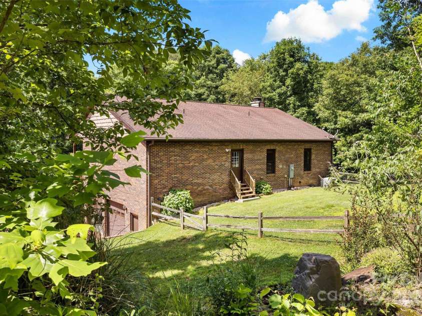 967 Clear Water Drive, Nebo, NC 28761.  MLS# CAR4147969, YatesRealty ID 7868. Back of the house with the spacious fenced in area for the furbabies.