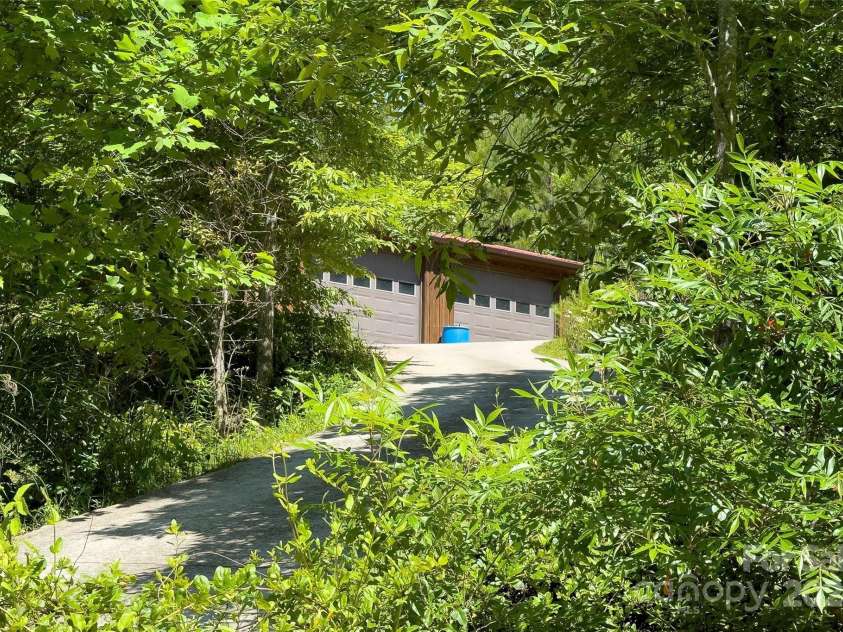 967 Clear Water Drive, Nebo, NC 28761.  MLS# CAR4147969, YatesRealty ID 7868. Back to man-built things, there's a concrete drive up the the detached/separate, two car garage.