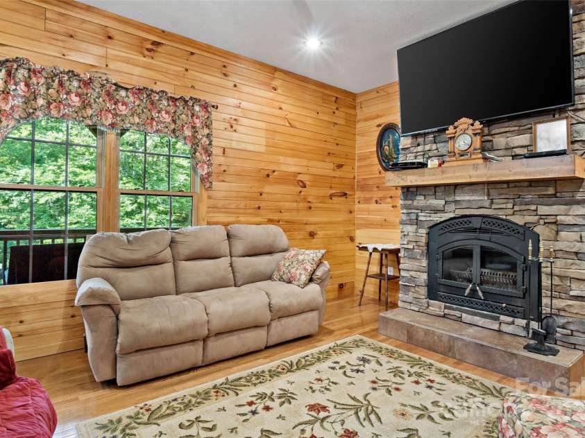 967 Clear Water Drive, Nebo, NC 28761.  MLS# CAR4147969, YatesRealty ID 7868. Upstairs, the living room has all the comforts of home