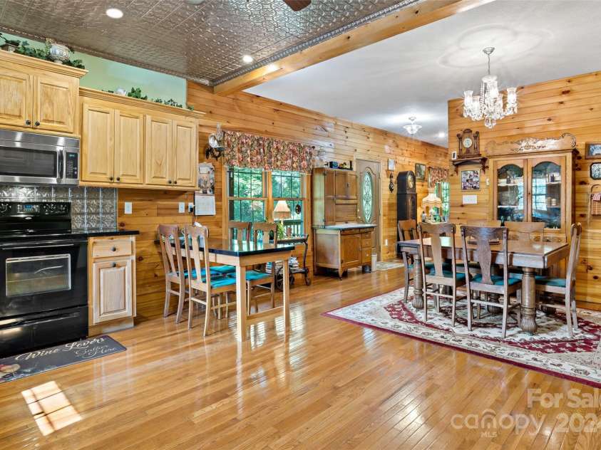 967 Clear Water Drive, Nebo, NC 28761.  MLS# CAR4147969, YatesRealty ID 7868. View from the back corner of the kitchen towards the dining area. and porch door. Room for everyday 