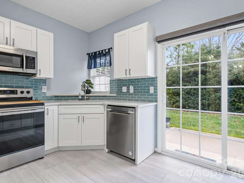 2737 Mill Valley Court, Matthews, NC 28105.  MLS# CAR4394021, YatesRealty ID 7894. Other updates include custom tile backspash, undermount single basin sink, and roller shade for patio door