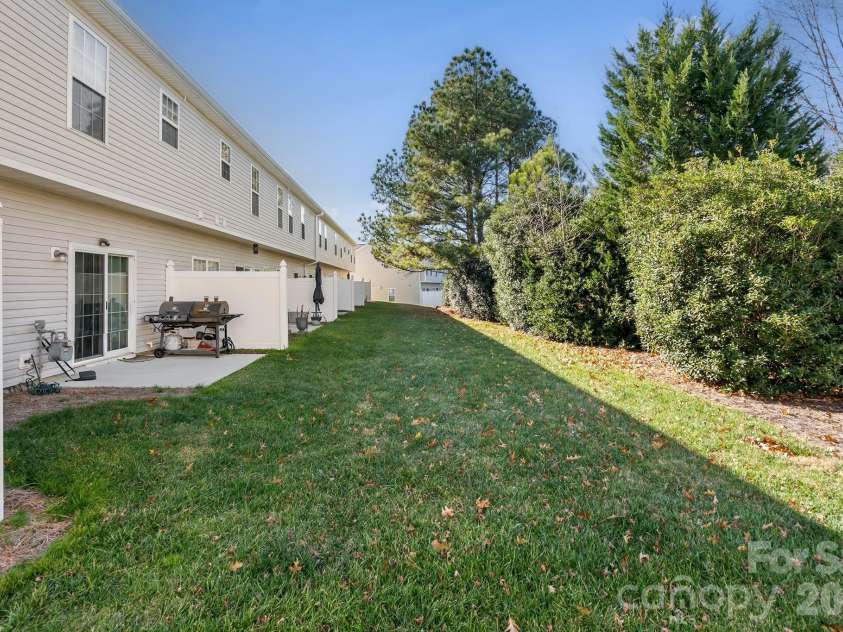 2737 Mill Valley Court, Matthews, NC 28105.  MLS# CAR4394021, YatesRealty ID 7894. This unit backs up to common area with a tree line buffer behind unit 