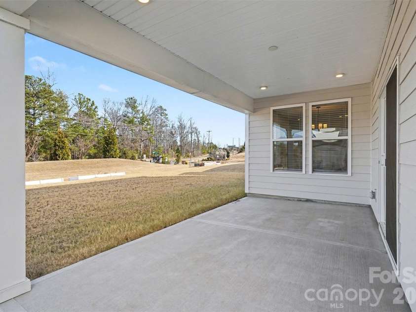 4266 Tournette Drive, Fort Mill, SC 29707.  MLS# CAR4338531, YatesRealty ID 7903. Covered back patio